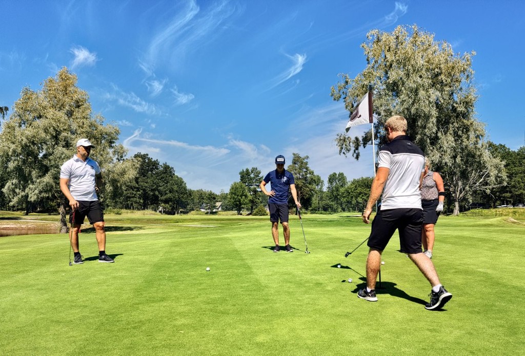 A group putting on a green